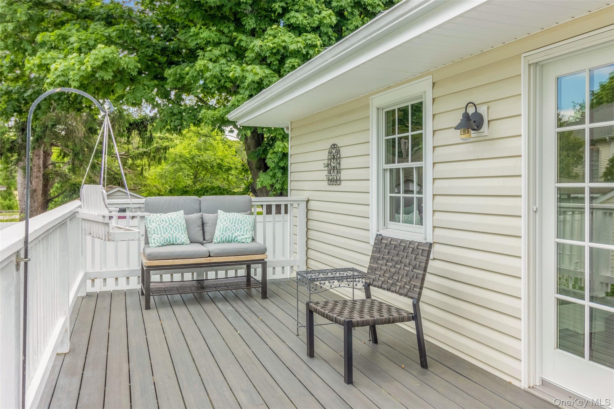 315 Wicks Road New Suffolk, NY 11956 - Photo 20 of 28 a view of a wooden chairs on the deck