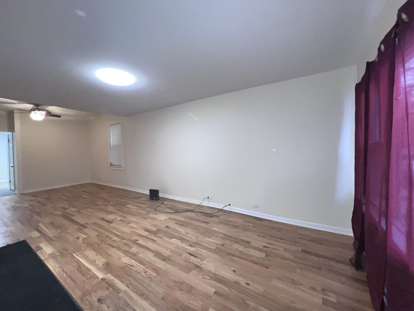 8919 South Muskegon Avenue, Unit 1F Chicago, IL 60617 - Photo 11 of 33 a view of empty room with wooden floor