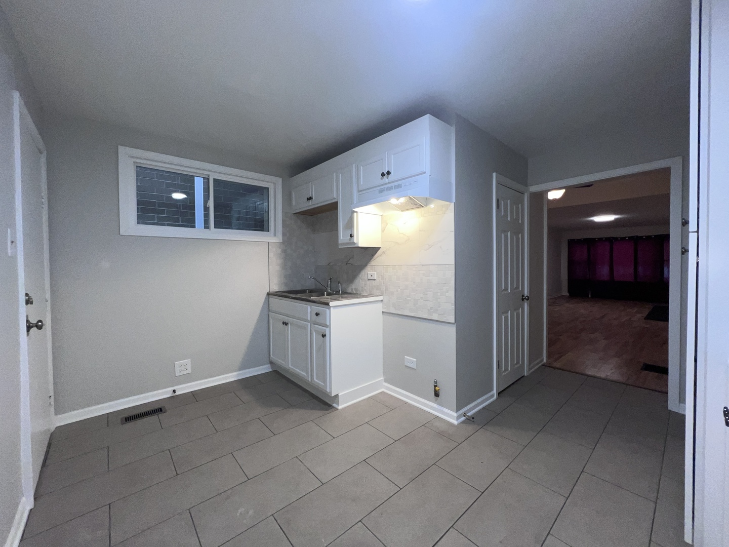 8919 South Muskegon Avenue, Unit 1F Chicago, IL 60617 - Photo 26 of 33 a view of a kitchen with storage and utility