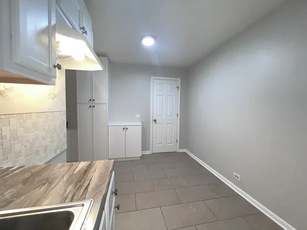 a view of a room has a bed and a window