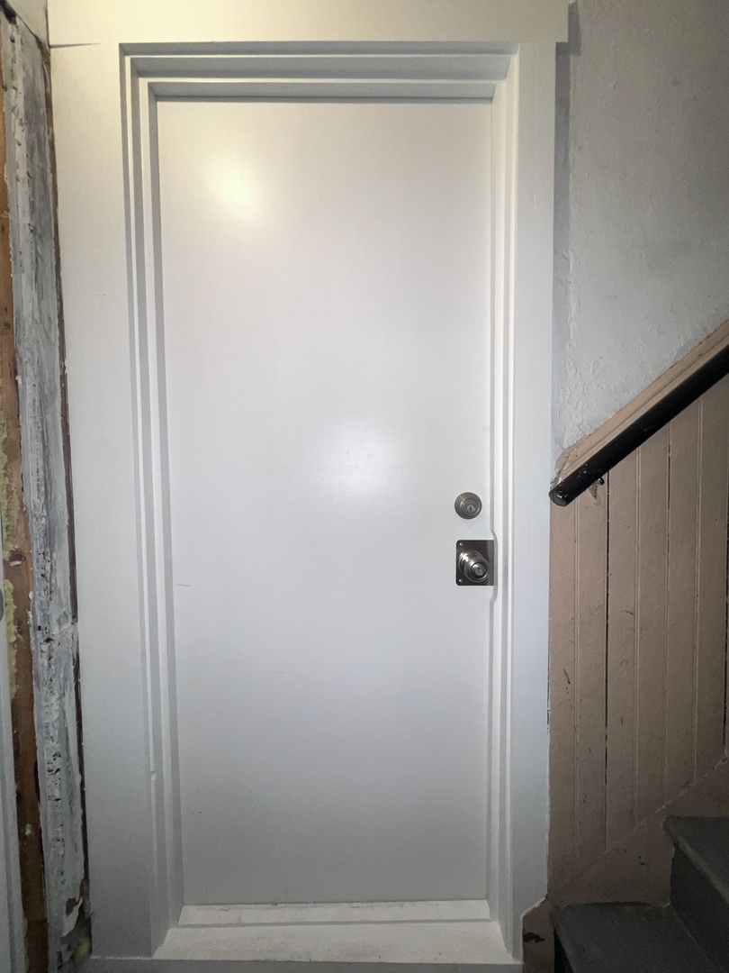 8919 South Muskegon Avenue, Unit 1F Chicago, IL 60617 - Photo 33 of 33 a bathroom with a glass shower door