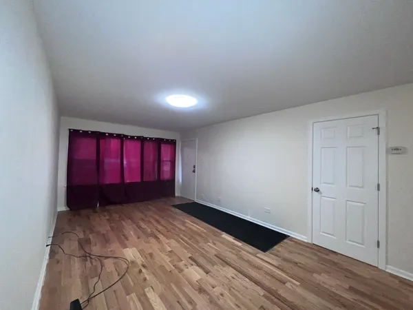 a view of an empty room and window