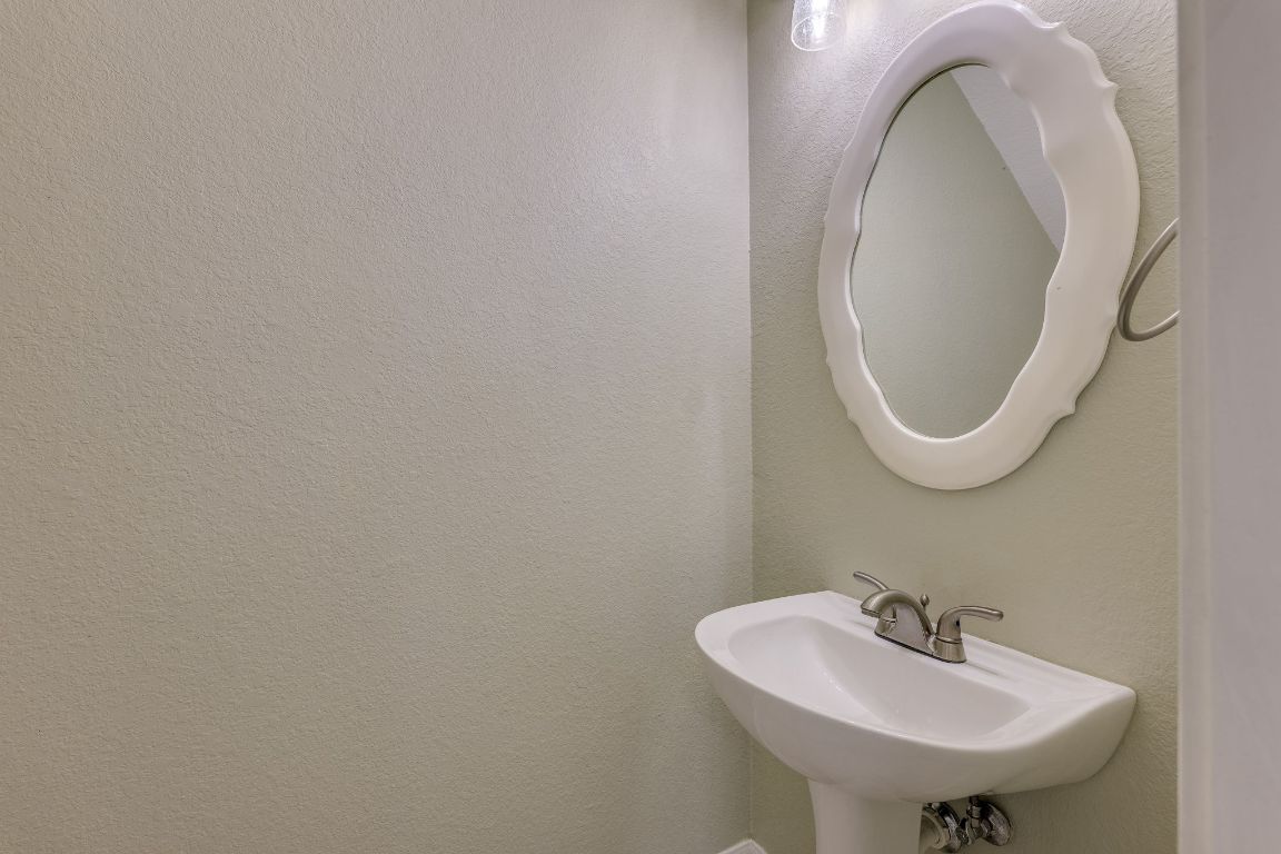 2100 Pipers Field Drive, Unit 14 Austin, TX 78758 - Photo 16 of 30 a bathroom with a sink and a mirror