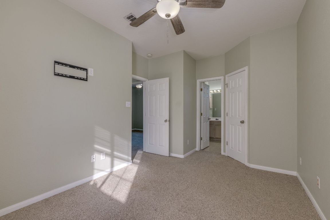 2100 Pipers Field Drive, Unit 14 Austin, TX 78758 - Photo 24 of 30 a view of empty room with a ceiling fan