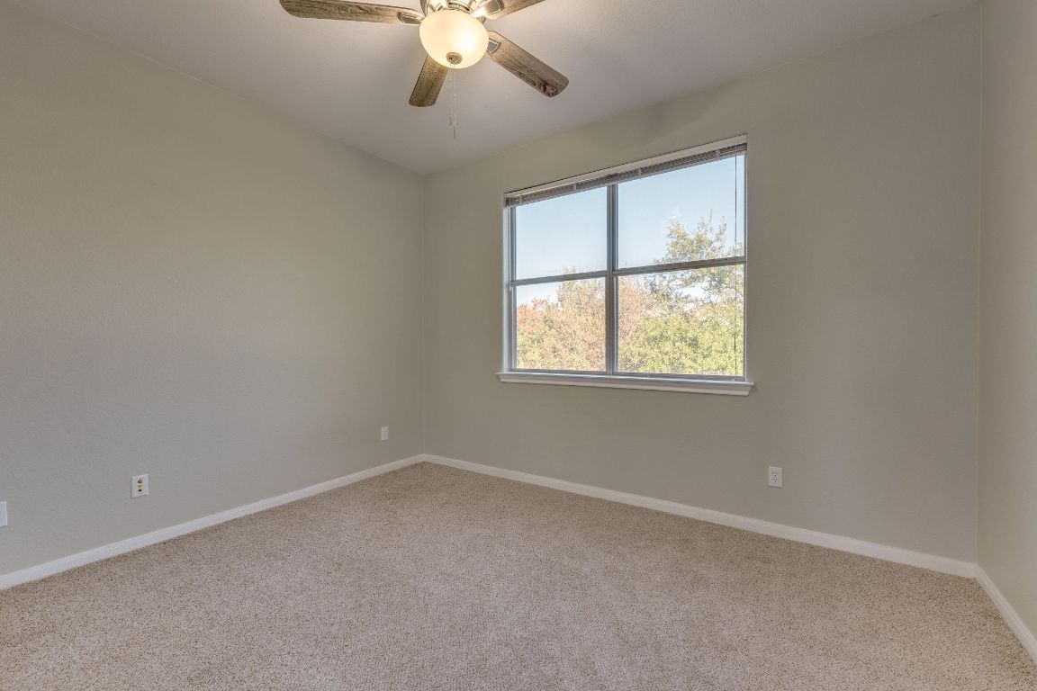 2100 Pipers Field Drive, Unit 14 Austin, TX 78758 - Photo 27 of 30 an empty room with a window