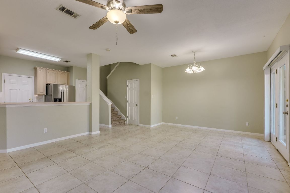 2100 Pipers Field Drive, Unit 14 Austin, TX 78758 - Photo 9 of 30 a view of a livingroom with a ceiling fan and window
