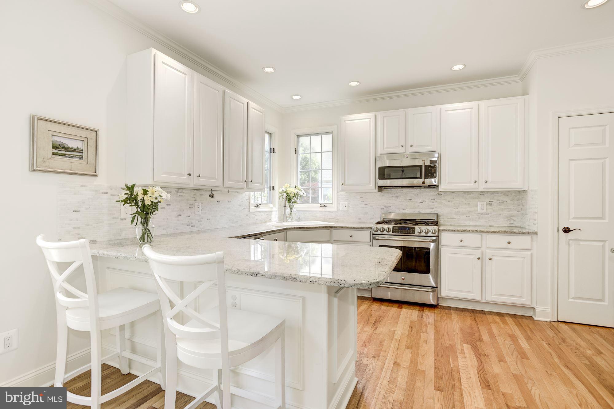 11410 Night Star Way Reston, VA 20194 - Photo 12 of 49 Kitchen with granite countertops, tile backsplash
