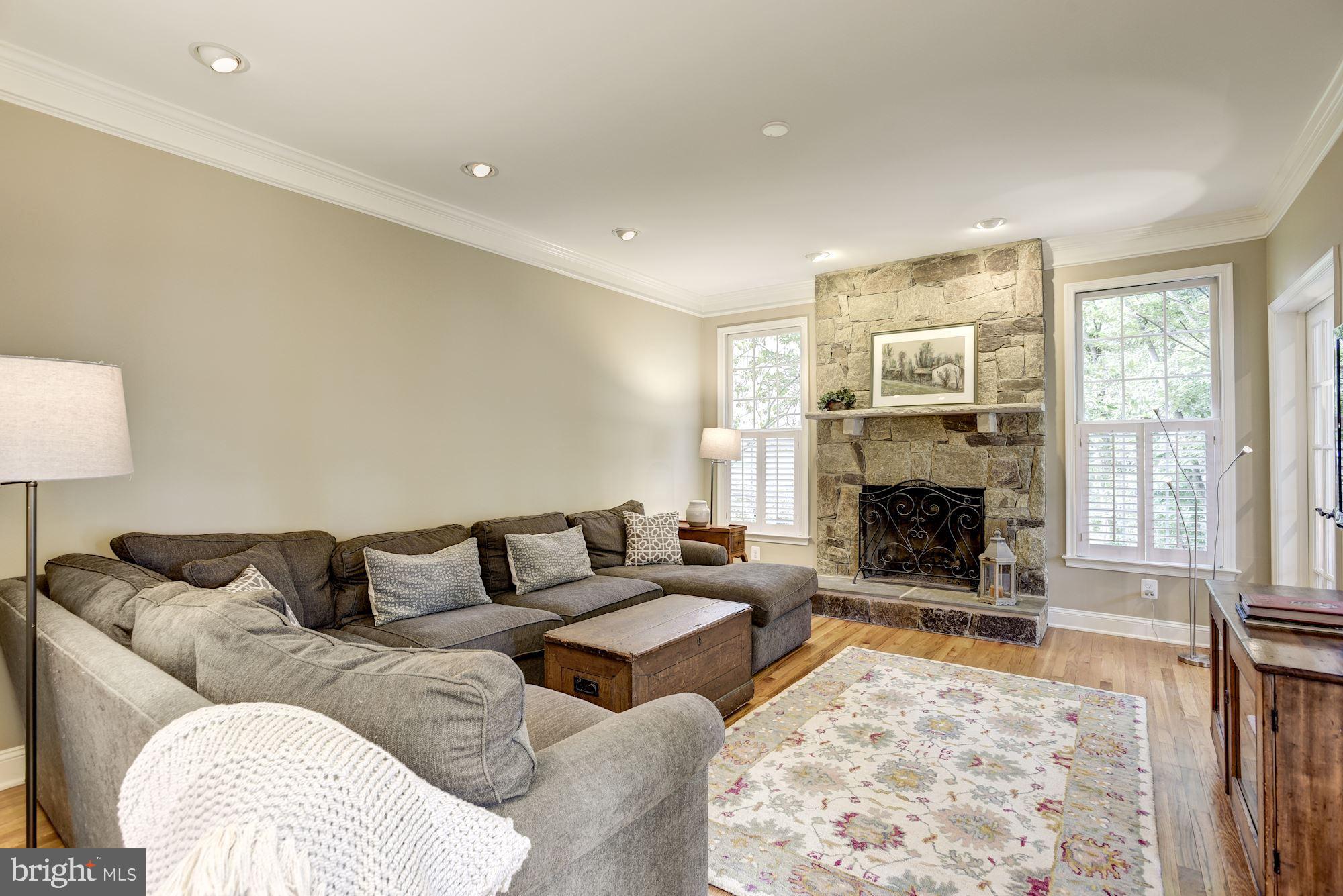 11410 Night Star Way Reston, VA 20194 - Photo 18 of 49 Wood burning stone fireplace warms the room