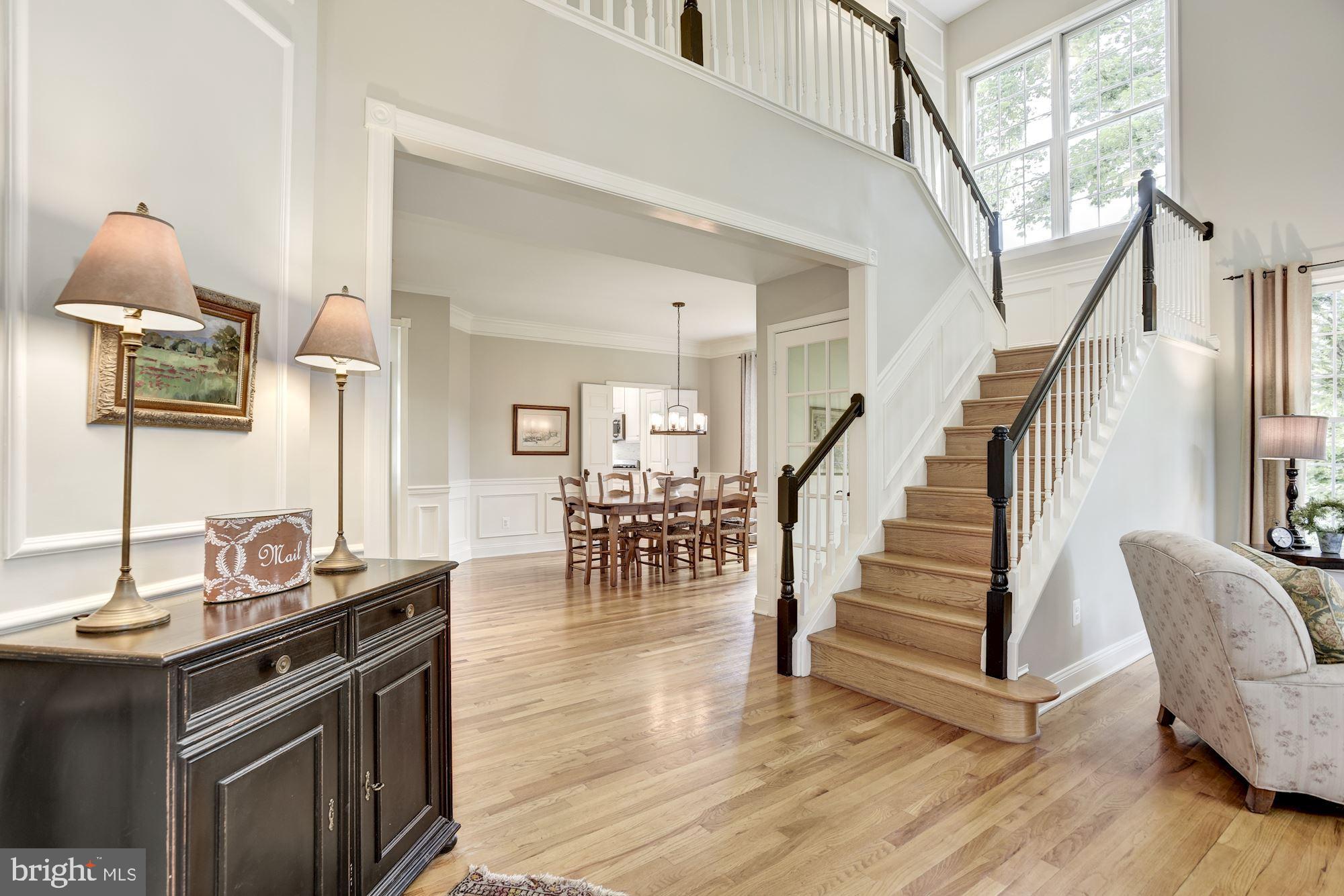 11410 Night Star Way Reston, VA 20194 - Photo 5 of 49 Two-story foyer & living room exudes natural light