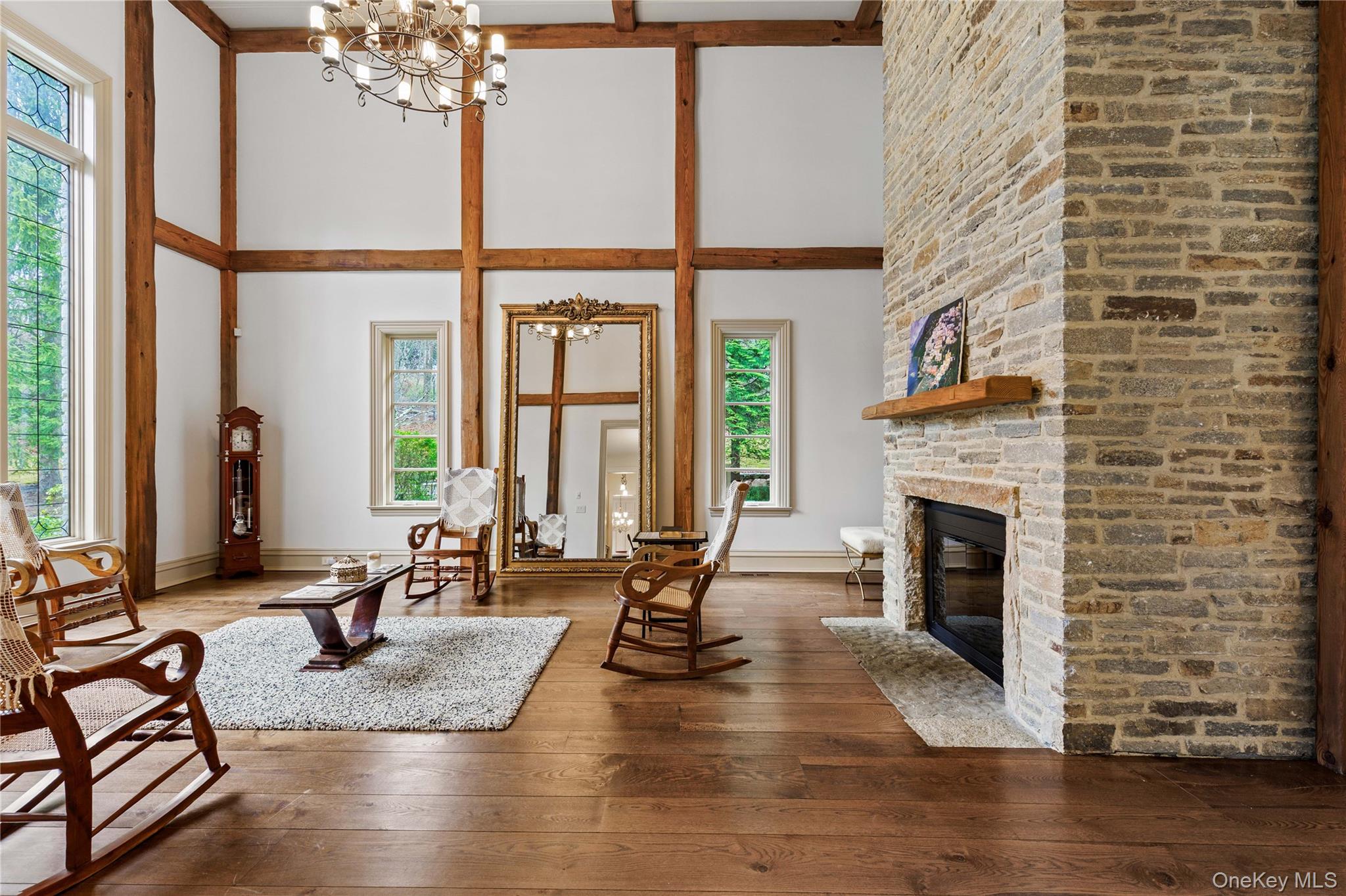 72 Guard Hill Road Bedford Corners, NY 10549 - Photo 14 of 50 a living room with fireplace furniture and a large window
