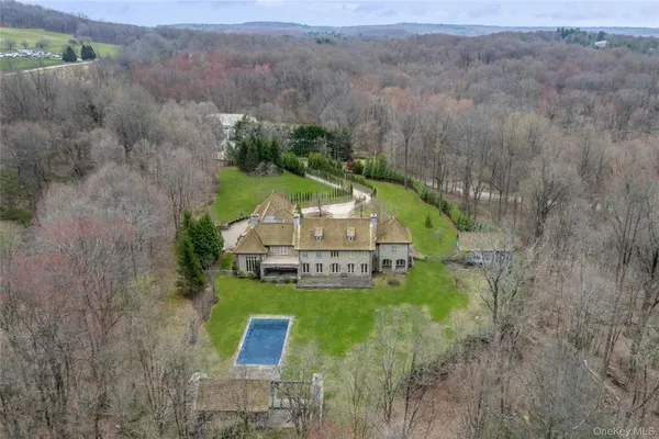 an aerial view of a house with outdoor space