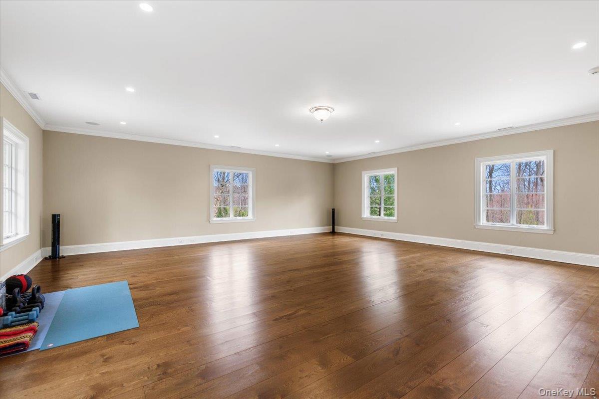 72 Guard Hill Road Bedford Corners, NY 10549 - Photo 34 of 50 a view of an empty room with wooden floor and a window