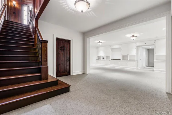 a view of an empty room with stairs