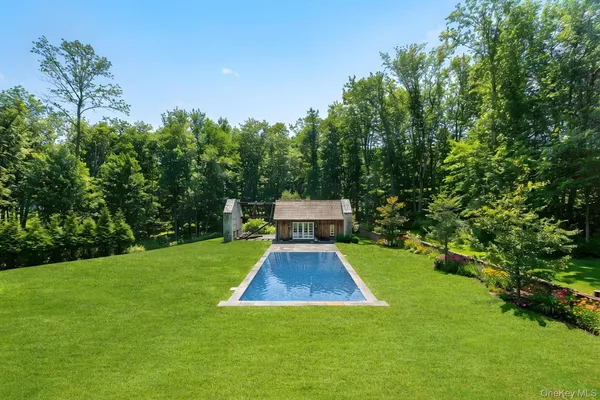a view of a park with iron fence