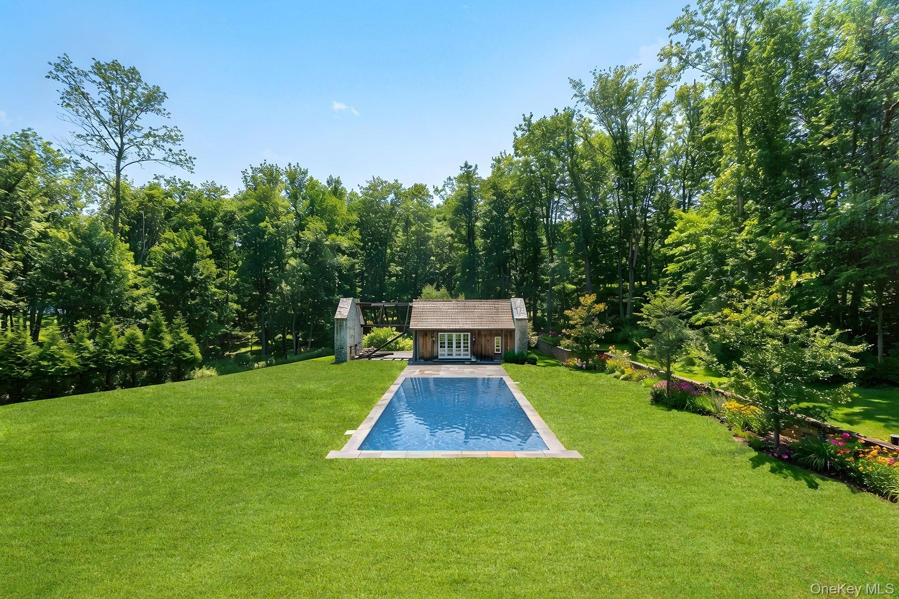 72 Guard Hill Road Bedford Corners, NY 10549 - Photo 41 of 50 a view of house with garden space and trees