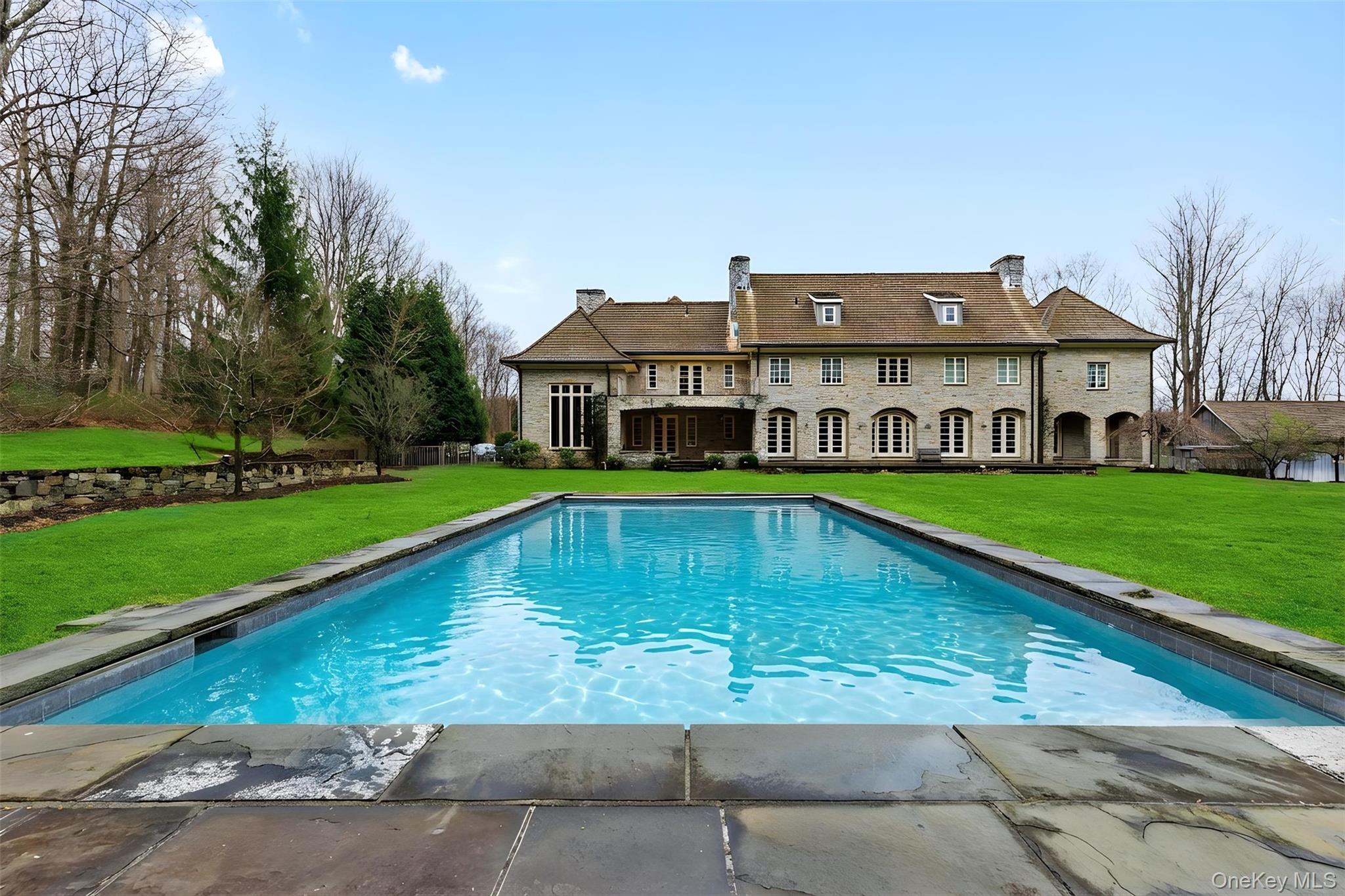72 Guard Hill Road Bedford Corners, NY 10549 - Photo 43 of 50 a view of an house with swimming pool and yard