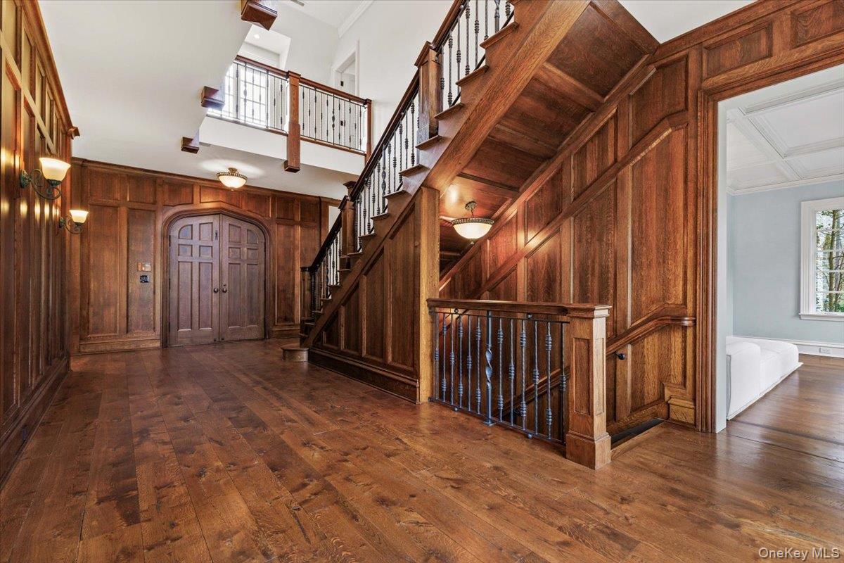 72 Guard Hill Road Bedford Corners, NY 10549 - Photo 6 of 50 a view of a hallway with wooden floor and staircase