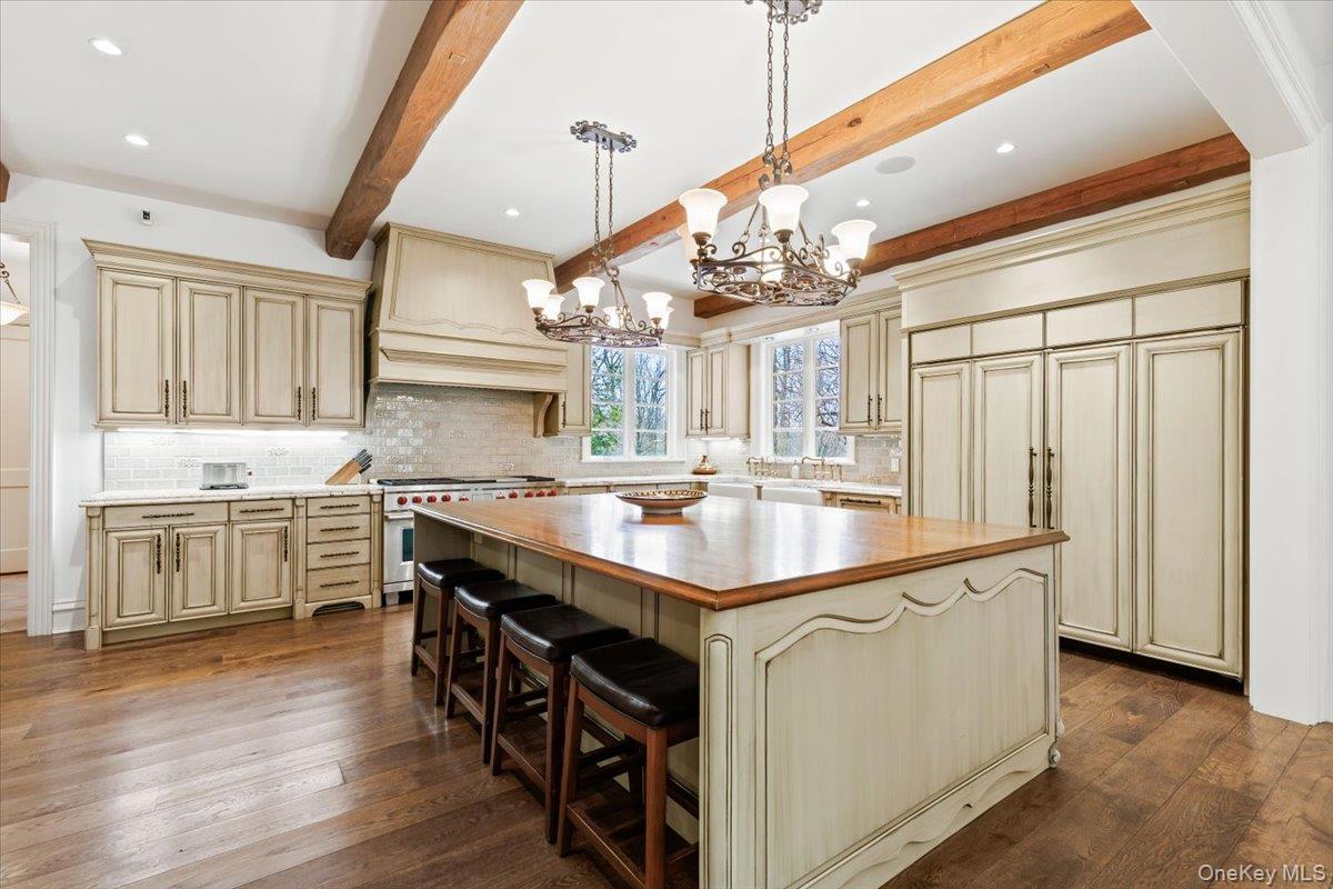 72 Guard Hill Road Bedford Corners, NY 10549 - Photo 8 of 50 a kitchen with kitchen island a sink appliances and cabinets