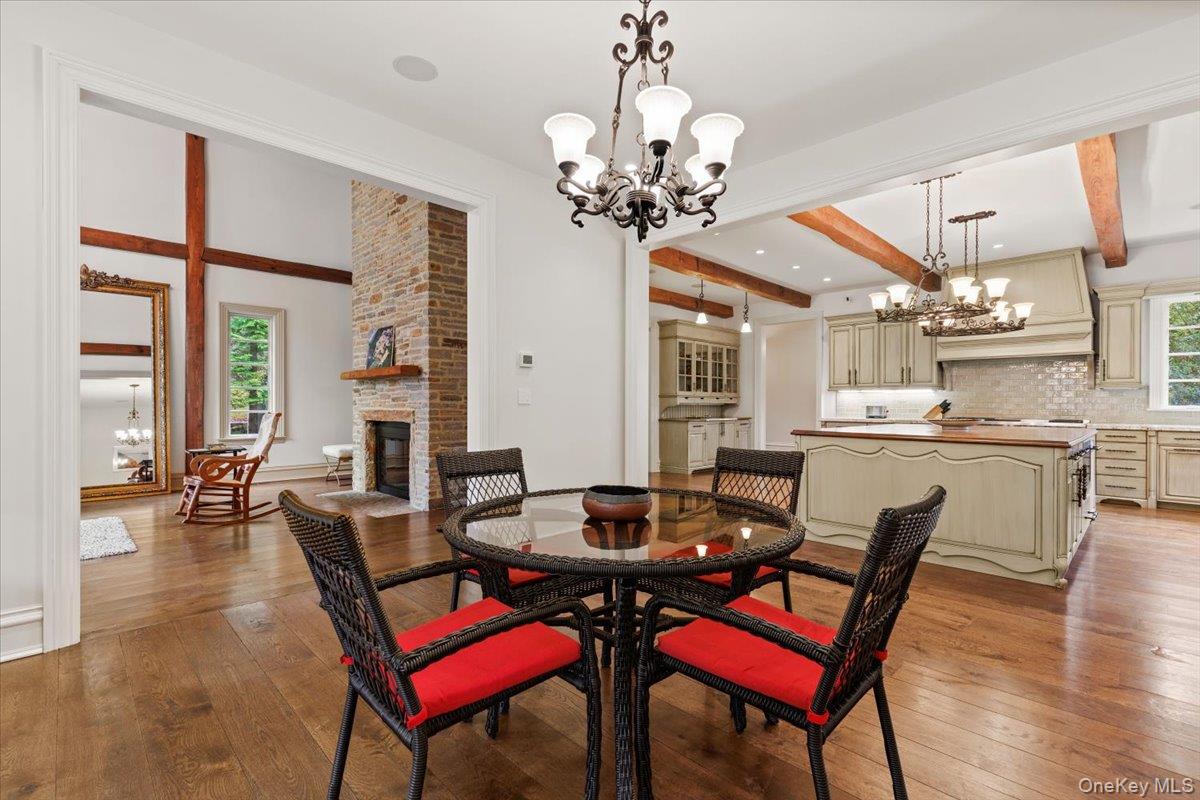 72 Guard Hill Road Bedford Corners, NY 10549 - Photo 10 of 50 a view of a dining room with furniture and wooden floor