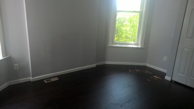 Undisclosed Address Chicago, IL 60623 - Photo 11 of 21 a view of an empty room with wooden floor and a window