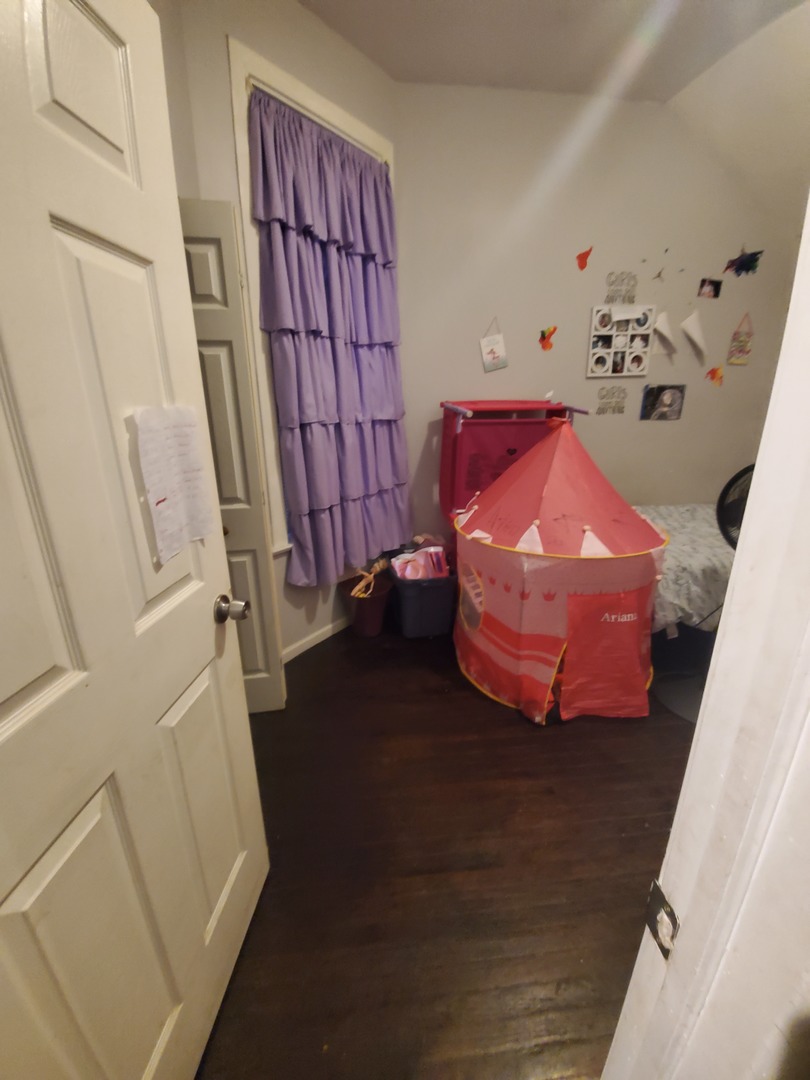 Undisclosed Address Chicago, IL 60623 - Photo 13 of 21 a room with toys and wooden floor