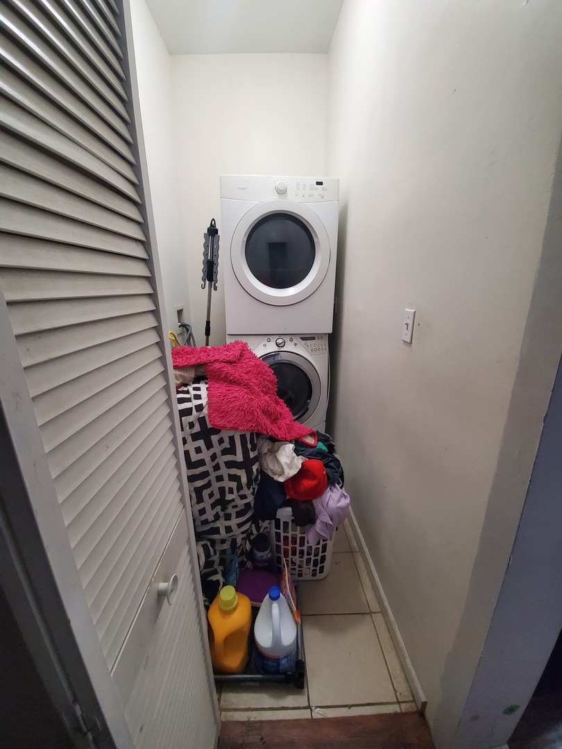 Undisclosed Address Chicago, IL 60623 - Photo 19 of 21 a view of a hallway with washer and dryer
