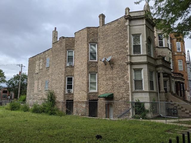 Undisclosed Address Chicago, IL 60623 - Photo 3 of 21 a brick building that has a lots of windows in it