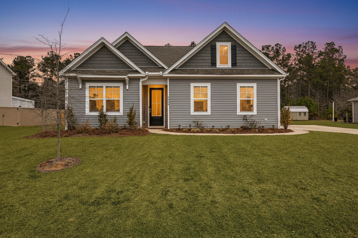 1062 Wading Point Boulevard Huger, SC 29450 - Photo 1 of 38 Twilight Front 2