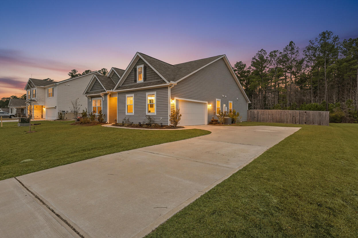 1062 Wading Point Boulevard Huger, SC 29450 - Photo 3 of 38 Twilight Front 1