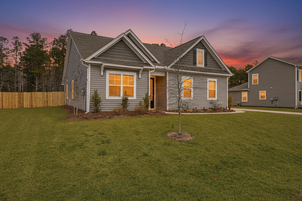 1062 Wading Point Boulevard Huger, SC 29450 - Photo 5 of 38 Twilight Front 3