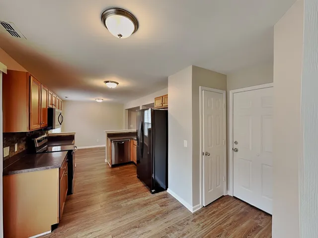 a view of a kitchen from the hallway