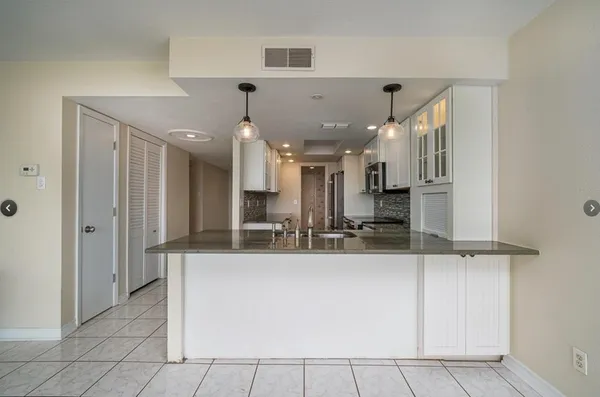 an empty room with sliding glass door and outdoor space
