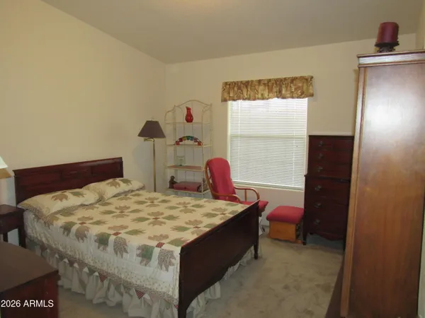 a bedroom with a bed and a closet