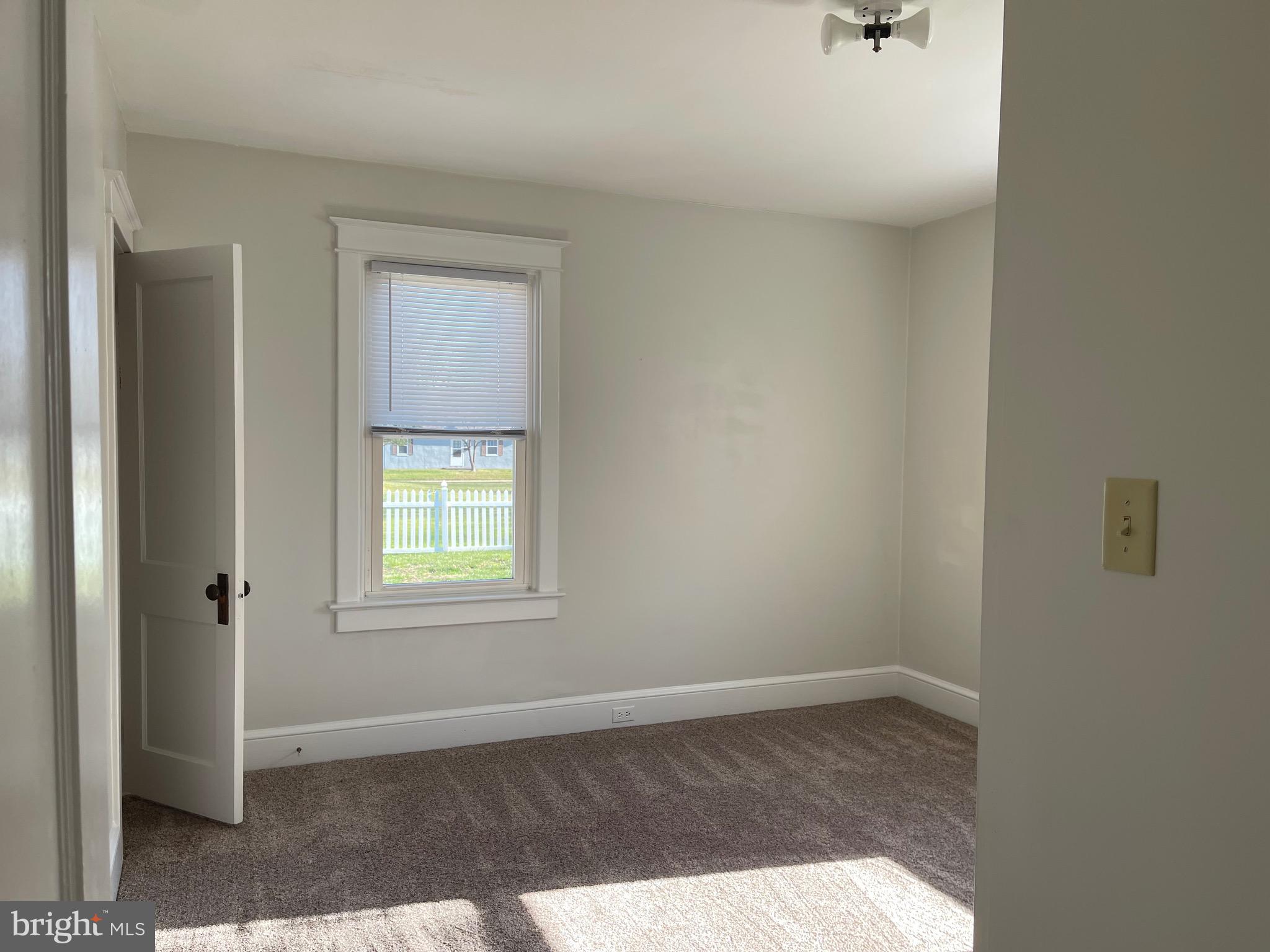 23 Addison Street Oxford, PA 19363 - Photo 5 of 15 a view of an empty room with a window