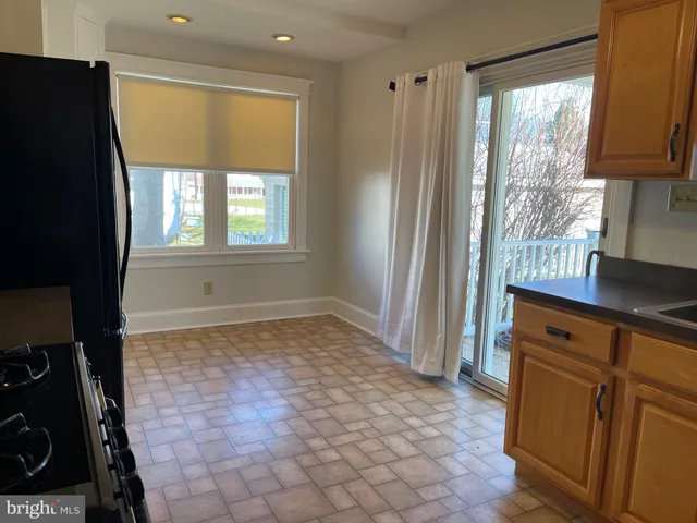 a view of a kitchen with a sink and a window