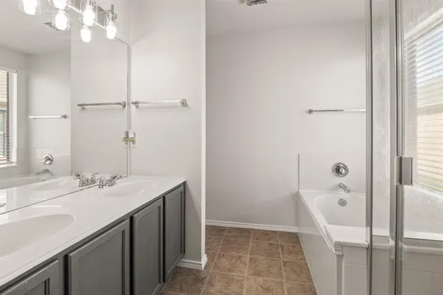 a bathroom with a sink a vanity and a mirror