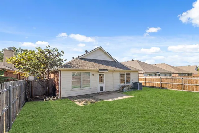 a view of a house with a yard and porch