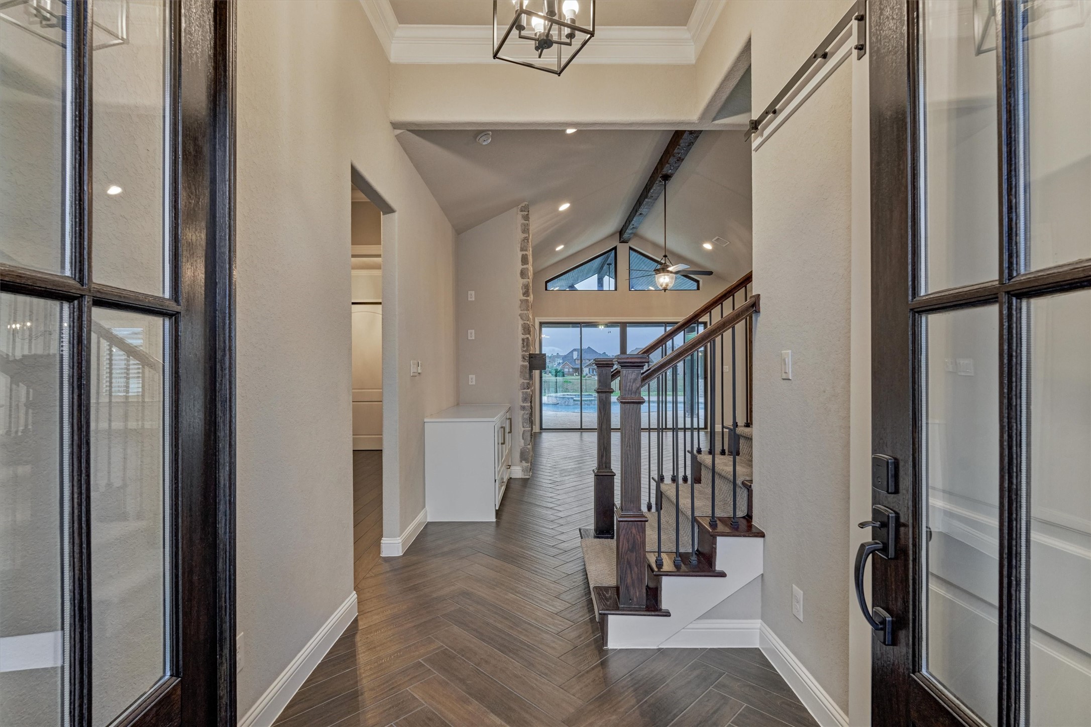 11618 Renaissance Drive Montgomery, TX 77356 - Photo 4 of 49 Glass-paneled front doors open to a bright, welcoming entry highlighted by a striking herringbone patterned tile floor.
