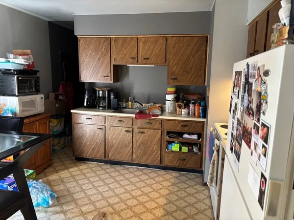 a kitchen with stainless steel appliances a sink and a refrigerator