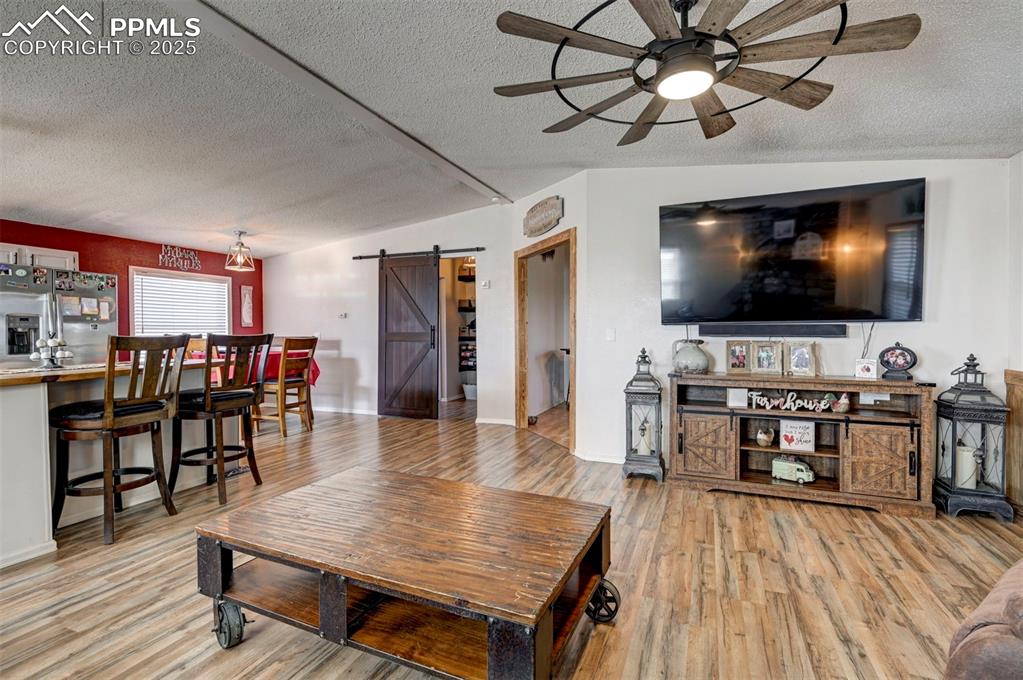 35355 Funk Road Calhan, CO 80808 - Photo 14 of 31 a living room with furniture and a flat screen tv