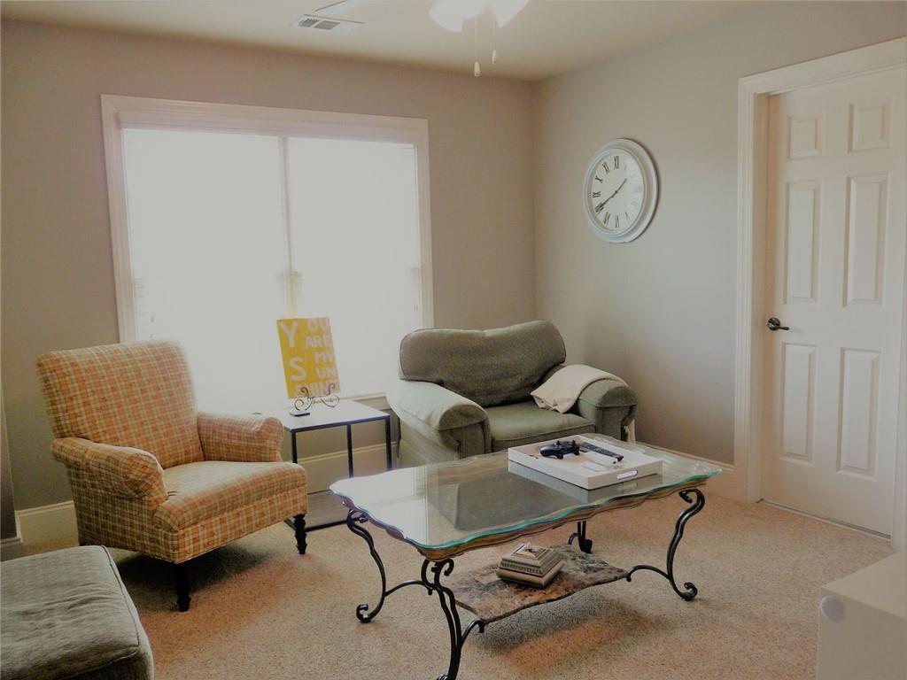 3970 Sweeting Street Cumming, GA 30041 - Photo 14 of 17 a living room with furniture and a window