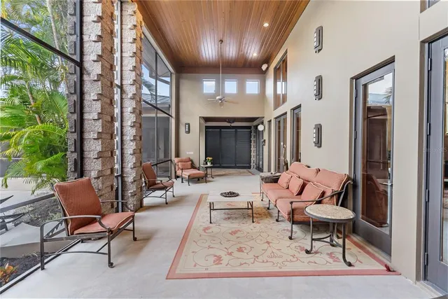 a building outdoor space with patio furniture and potted plants