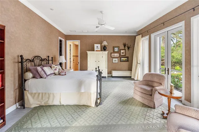 a bed room with a bed and a chair