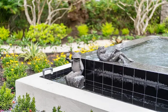 a living room with furniture gym equipment and a window