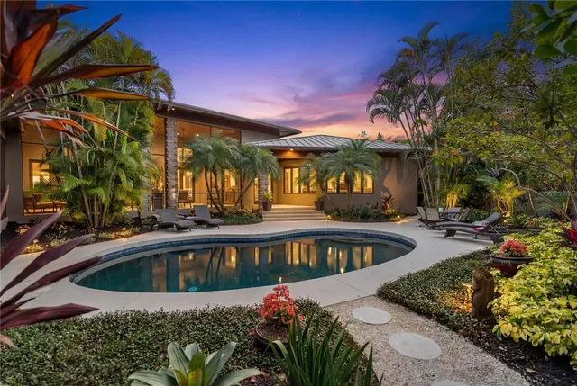 a view of a swimming pool with a patio