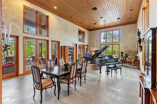 a dining room with furniture and wooden floor