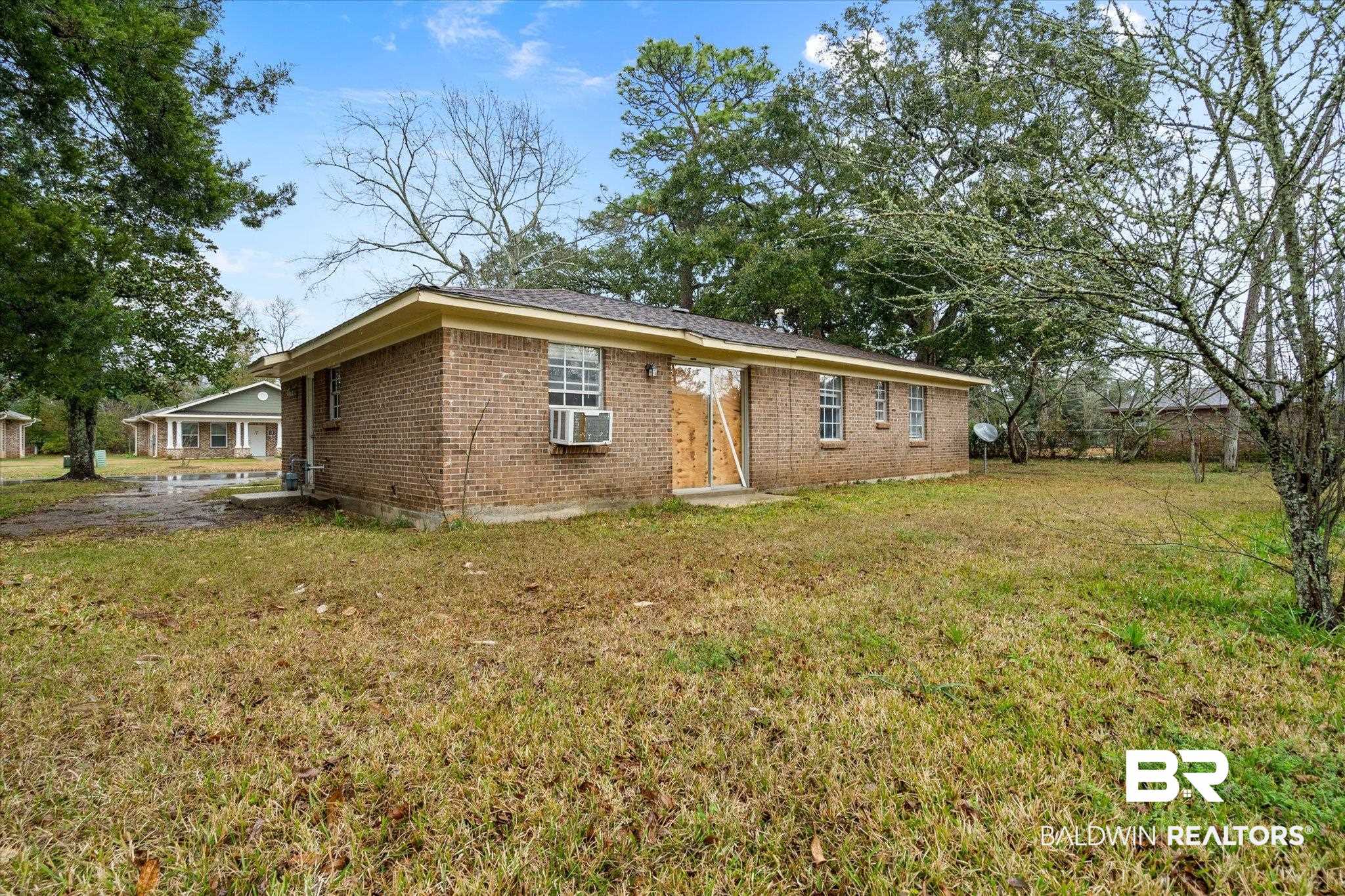 313 West 4th Avenue Foley, AL 36535 - Photo 17 of 20 View of front of house with a front yard and cooling unit