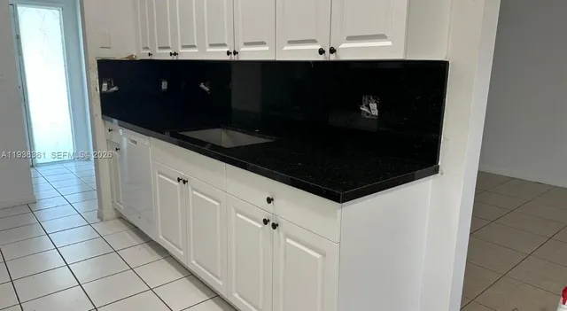a view of cabinets and microwave