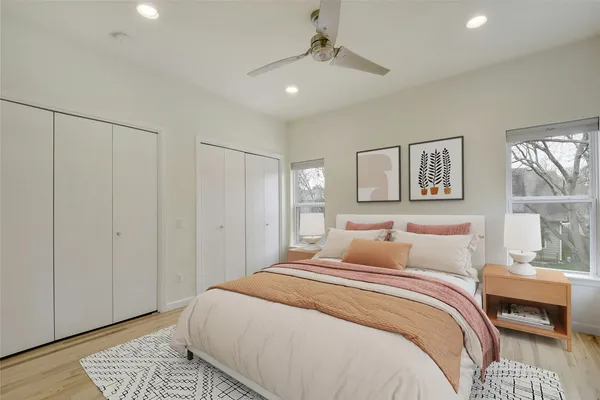 a bedroom with a large bed and a window