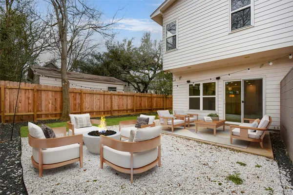 a outdoor living space with patio furniture and garden view
